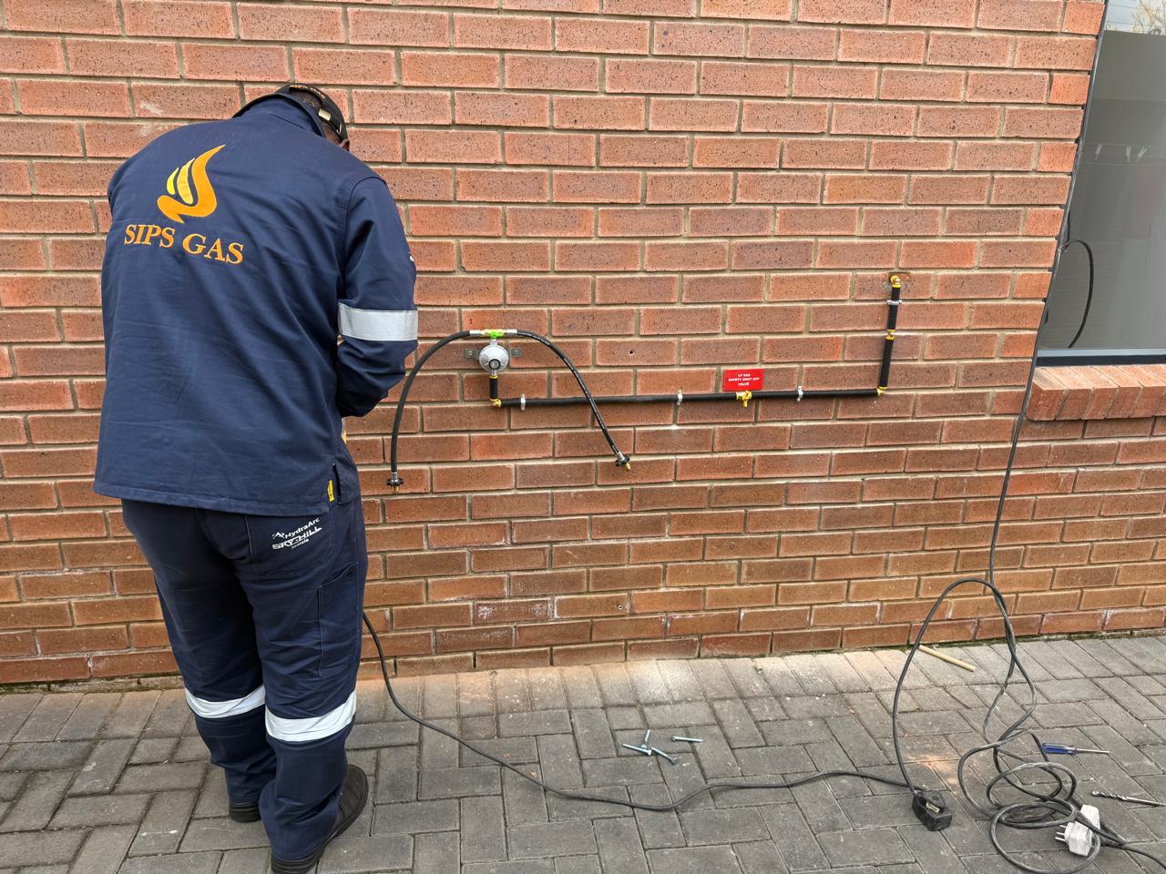Sips Gas technician working on an LPG installation